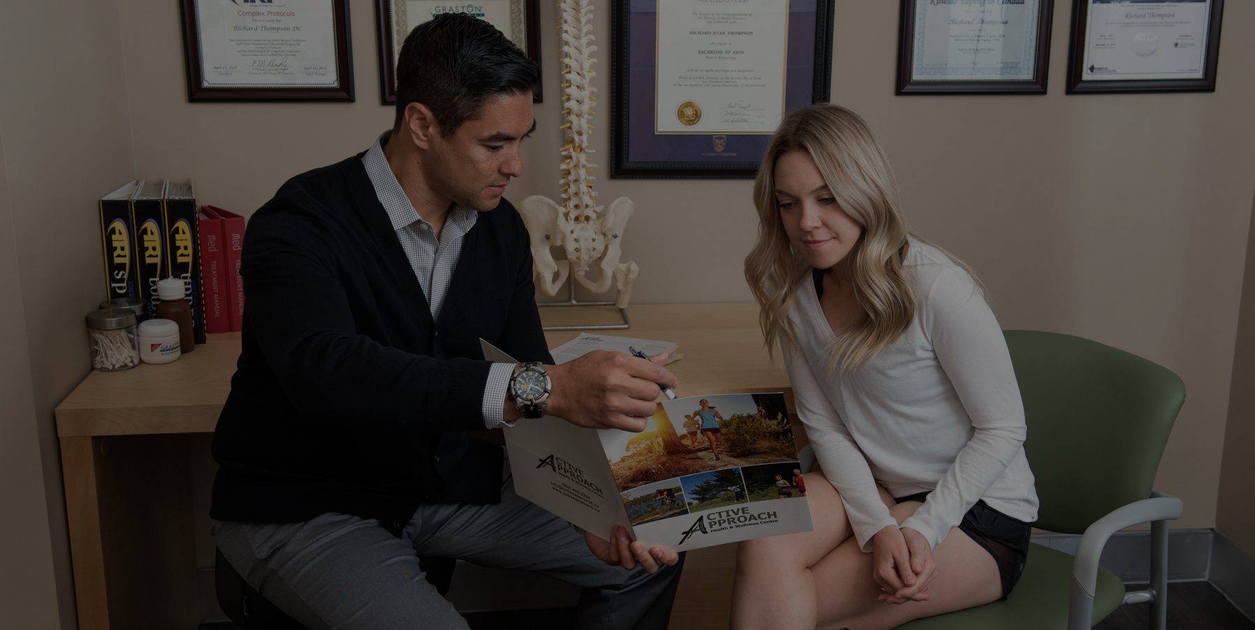 a man and woman sitting at a desk